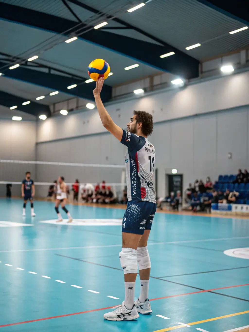 A student focused and determined while playing volleyball, illustrating the development of discipline and focus through sports at ASSOCIATION SPORTIVE DU LYCEE JEAN GUEHENNO.